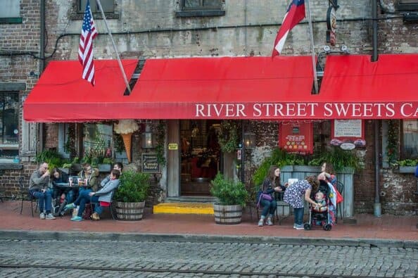 River street sweets is a popular family stop on this touristy savannah street. Look for the red awning.