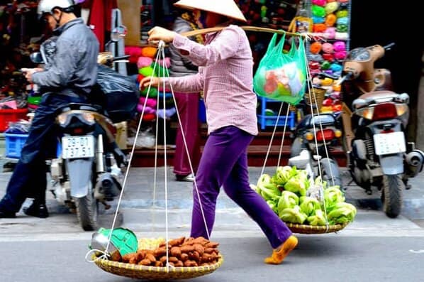 A peddler with her wares in hanoi