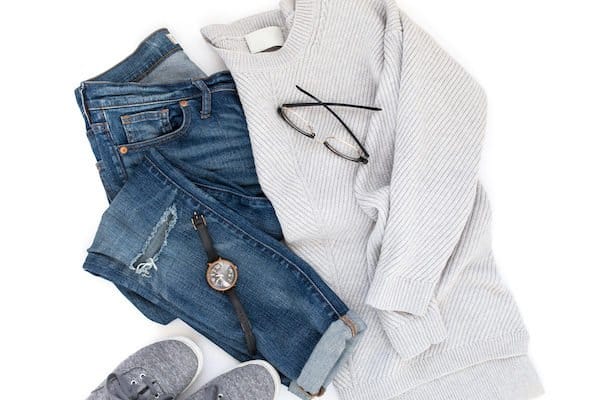 how to organize clothing with sweater, jeans, watch and shoes