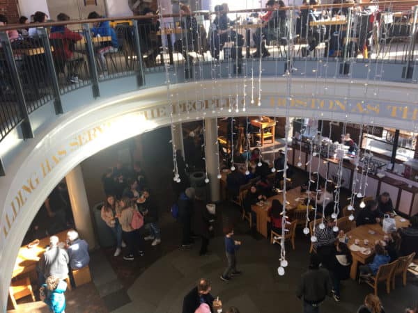 The busy two-story food hall at quincy market