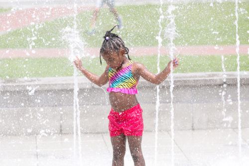 Kids love to cool off in the fountains on savannah's ellis square.