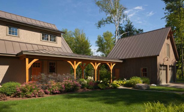 the cedar covered walkway is connected to the garage and the porch
