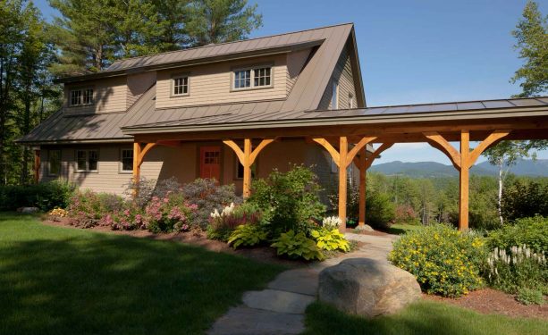 the covered walkway is build near a natural-styling garden landscape