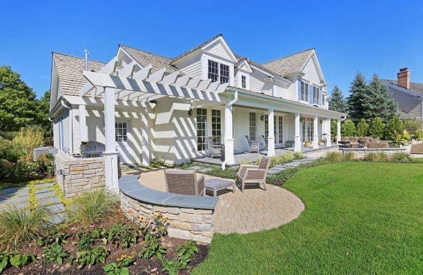an elegant exterior with white siding and white brick combination