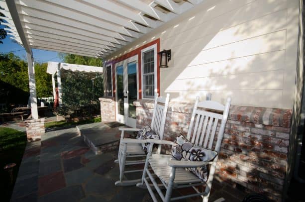a beautiful exterior with the combination of whitewashed brick and off-white siding