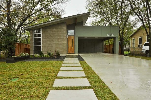 a carport attached to two sides of a midcentury house