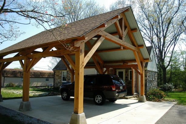 an amazing, handcrafted timber carport addition in a craftsman house facade