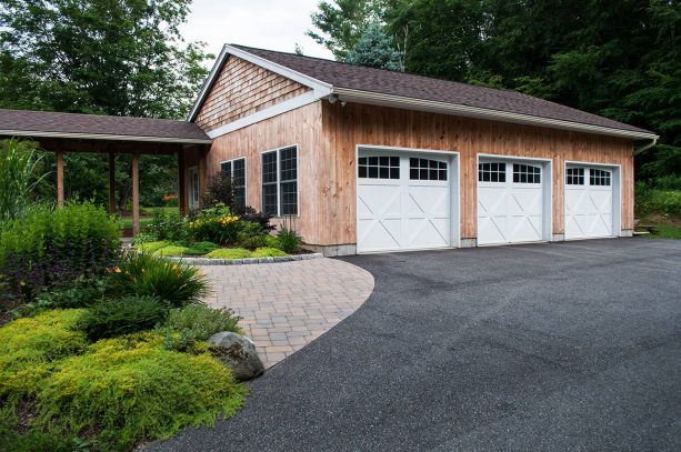 the farmhouse 3-car garage that is connected to the main house with a simple walkway