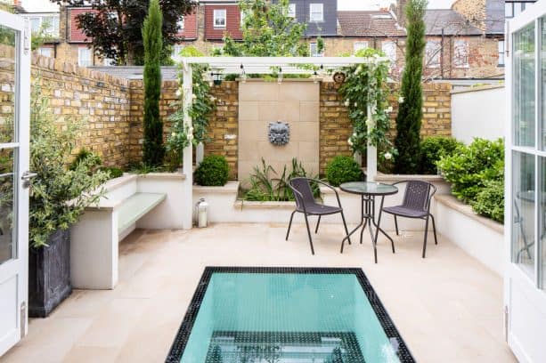 a small walkout basement patio with beautiful design
