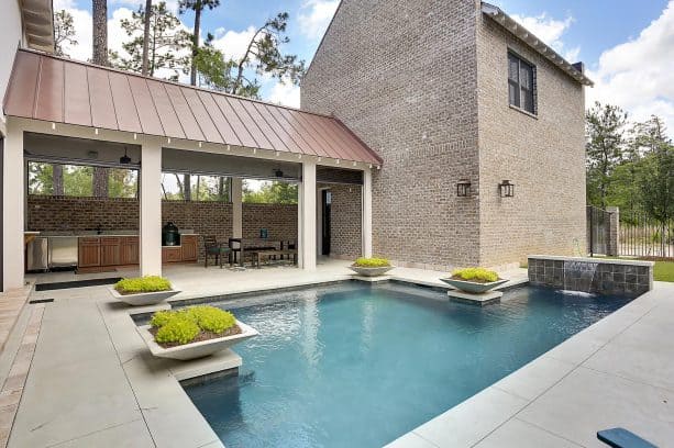 a contemporary house with bronze metal roof