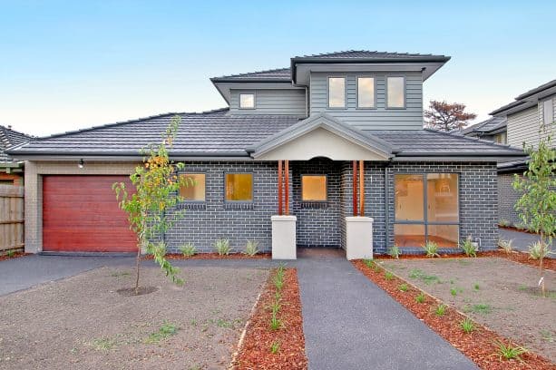 grey siding on grey brick design for a unique coordinating look