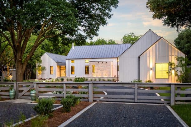 a fabulous modern farmhouse exterior with Agreeable Gray SW 7029 paint color