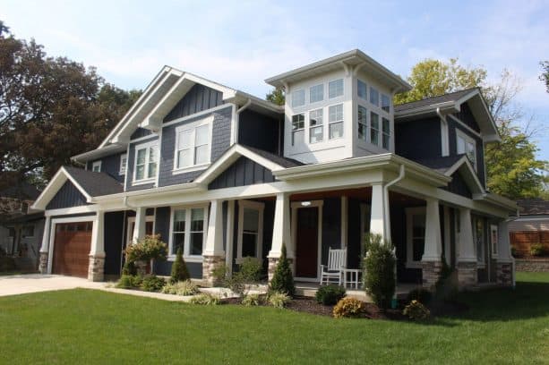 a farmhouse exterior with Deep Ocean James Hardie Siding and white trim