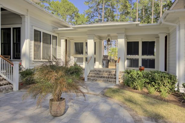 a garage walkway comes with not only cover but also stairs and louvers as extra features