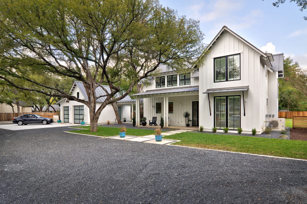 the view of the house and the garage with the covered walkway connecting them