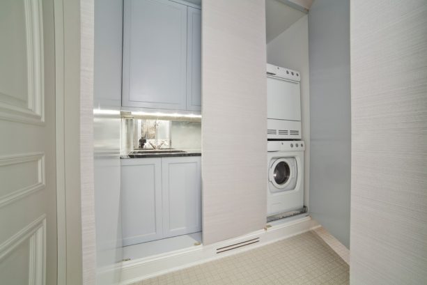 a hidden laundry closet behind the flat doors