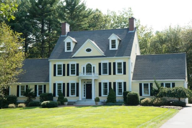 exterior color scheme with pale yellow, white, grey, and black colors