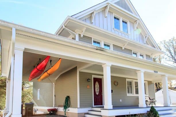 a closer look to the space-saving, hanging canoe storage on the attached carport ceiling