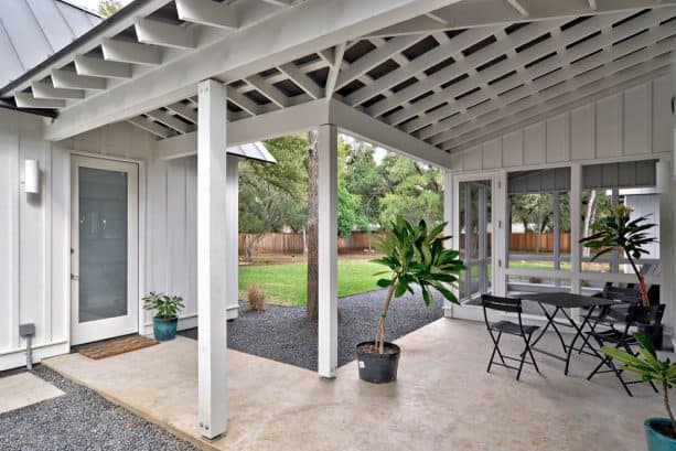 the covered walkway is also connected to a screened porch nearby