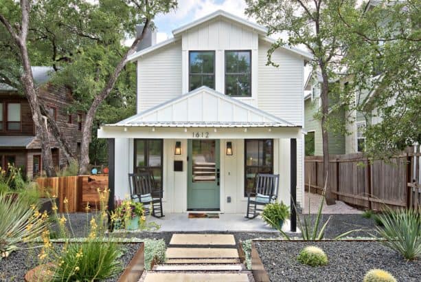 a fabulous farmhouse exterior with Simply White OC-117 paint for the siding and Azores AF-495 for the front door