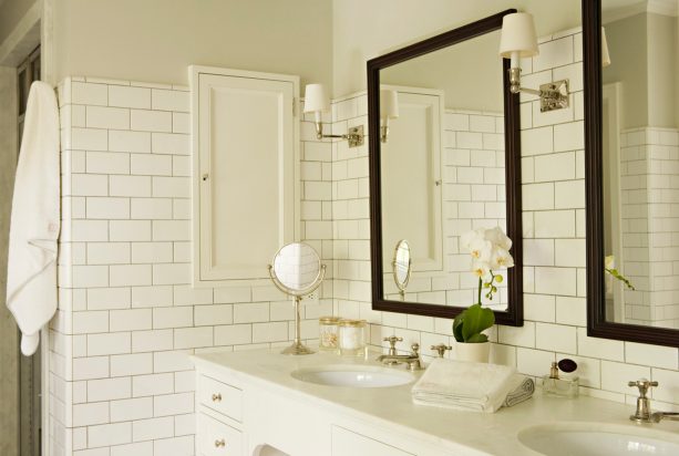 cozy traditional bathroom with warm white subway tile and platinum gray grout
