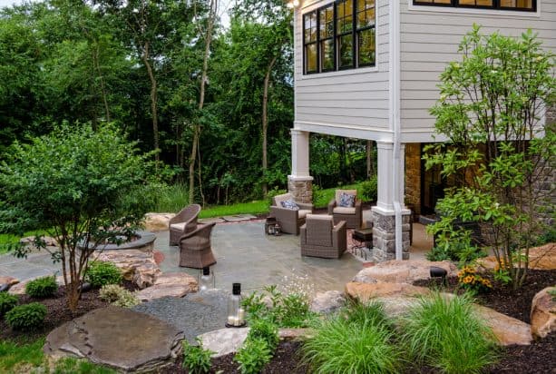 a traditional walkout basement patio that is focused more as an alternative seating area
