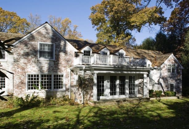 traditional home exterior with german smear brick wall