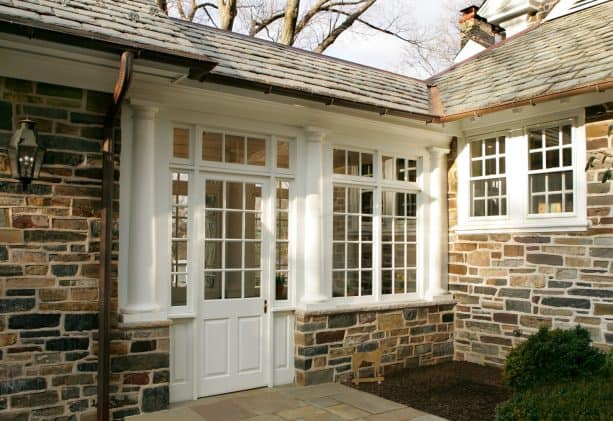 the closer look of the walkway shows that it comes with stone wall, door, and windows