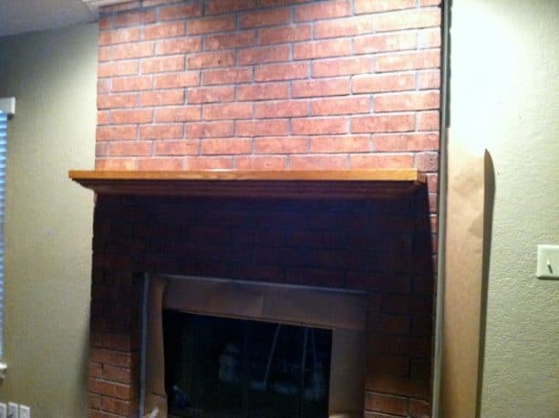 before makeover floor to ceiling red brick fireplace