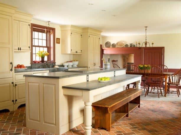 brick tile flooring in herringbone pattern in a farmhouse kitchen