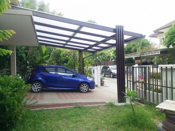 a modern house with semi-transparent attached carport for two cars
