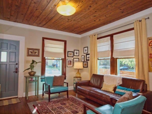 turquoise leather chairs with wooden frame in a traditional living room