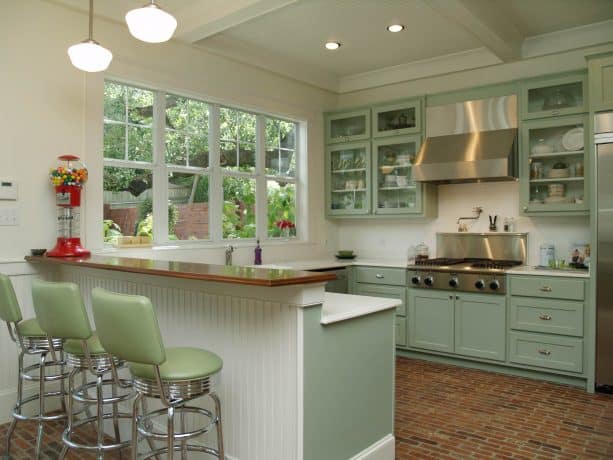 a half wall that also works as a breakfast bar in a traditional open kitchen