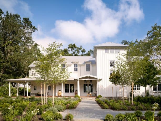a beautiful two-story farmhouse residence with China White OC-141 color