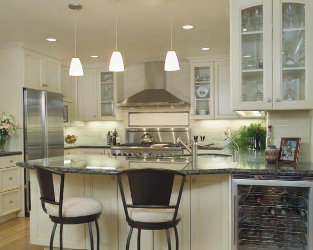 cream kitchen cabinets paired with stainless steel appliances
