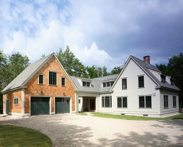the walkway comfortably connects the 2-car garage and the main entrance of the house
