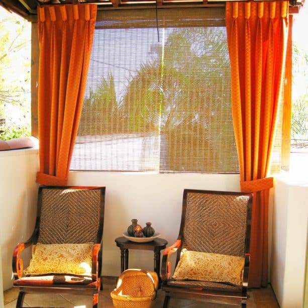 Mediterranean patio with bamboo blinds at the back