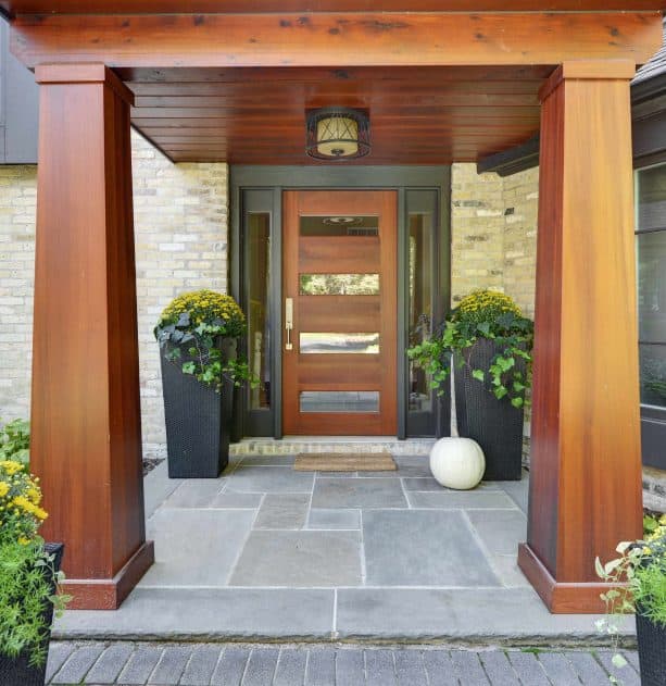 contemporary front door with brown stain and black trim