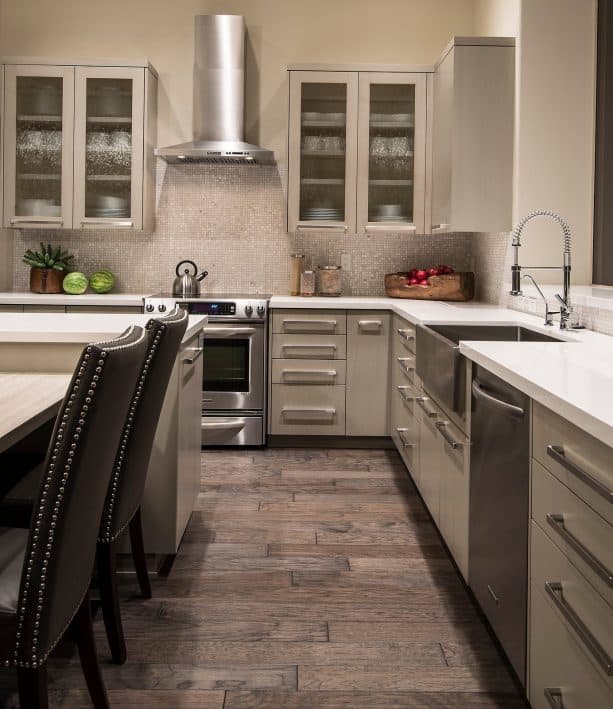 off-white kitchen cabinets paired with stainless-steel appliances