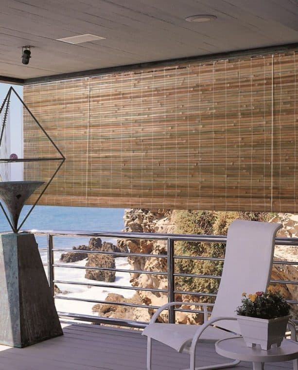 the use of roll-up bamboo blind in a beach house balcony