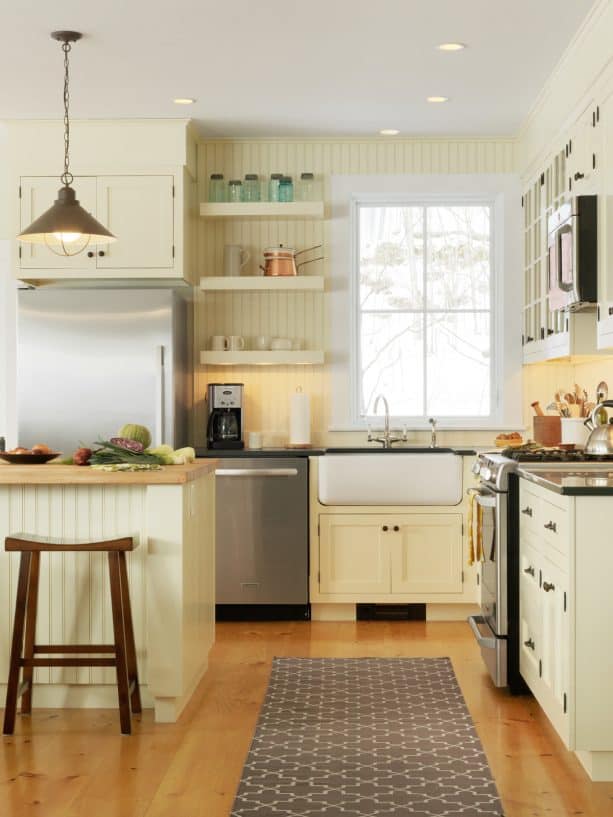 off-white kitchen cabinets on an off-white wall