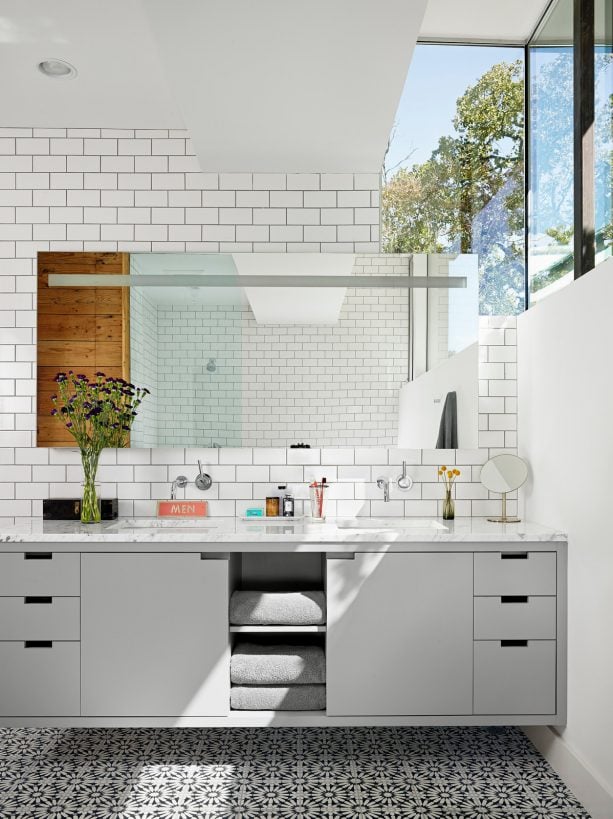 a contemporary bathroom with a lot of sunlight
