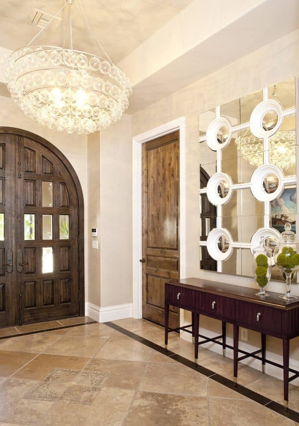 a wood door with medium brown stain and white-painted trim