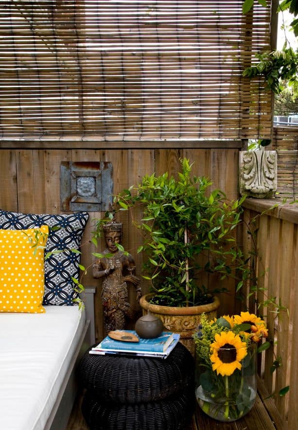 roll up bamboo blind to reduce breeze and add privacy in a patio
