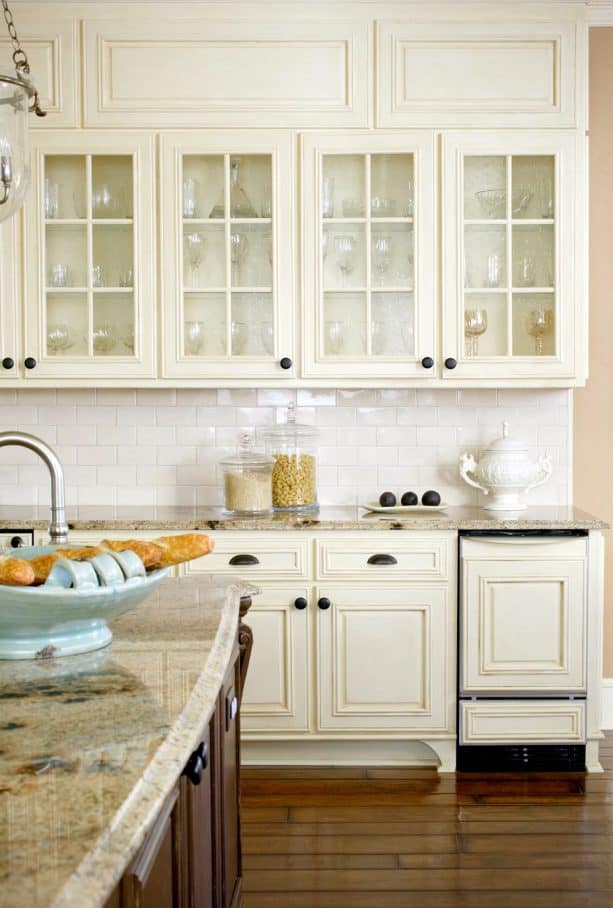 kitchen with antique white cabinets and white subway tile backsplash