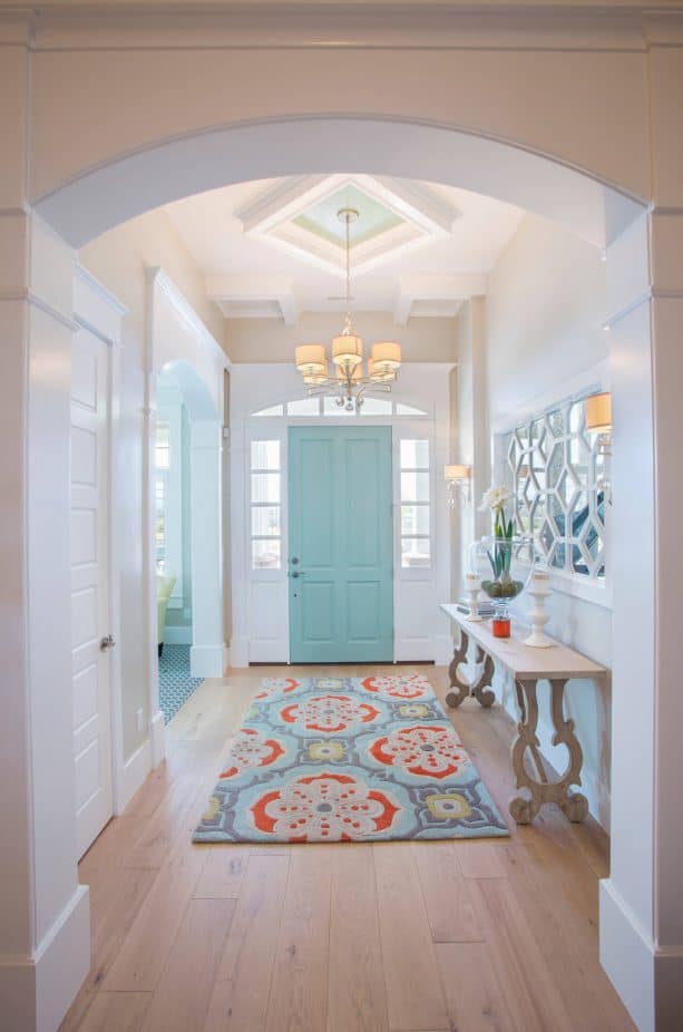 transitional entry with sky blue door and white trim paint color