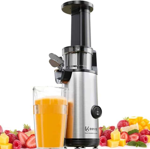 Image shows a juicer and a selection of fruits and vegetables.