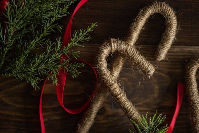 twine candy canes on a wood table