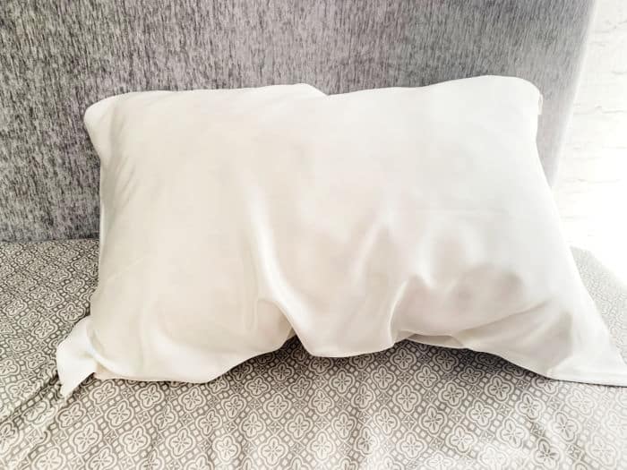 silk pillowcase on grey bedding