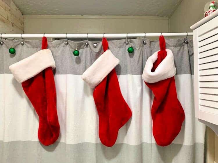 Christmas stockings hung on a shower curtain
